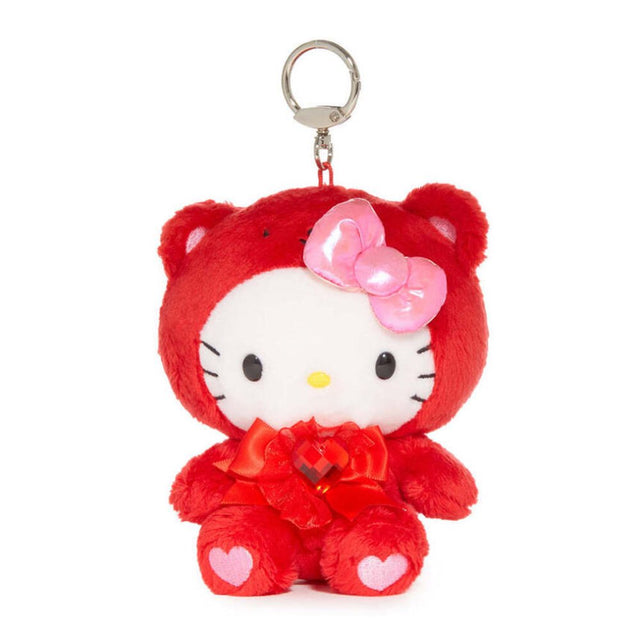 An officially licensed Sanrio Hello Kitty January birthstone plush keychain clip wearing a red garnet-themed hood, a pink bow, and a red ribbon with a heart gem.