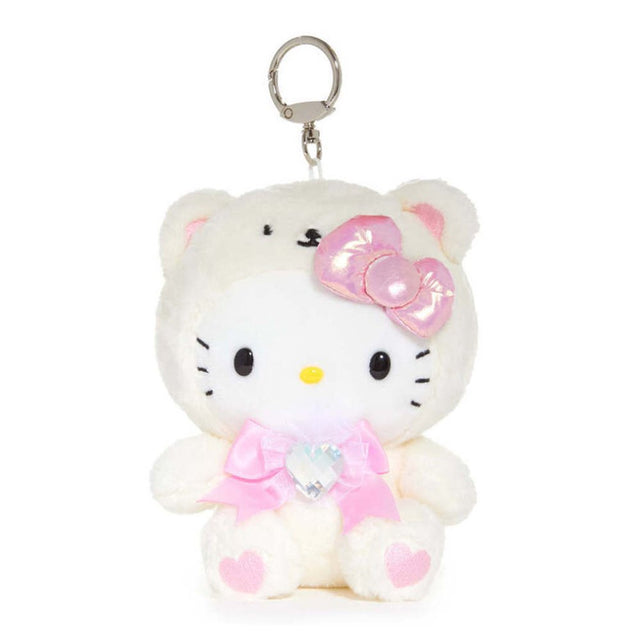 An officially licensed Sanrio Hello Kitty June birthstone plush keychain clip wearing a cream white bear hood, a metallic pink bow, and a pink ribbon with a heart-shaped faux gemstone.