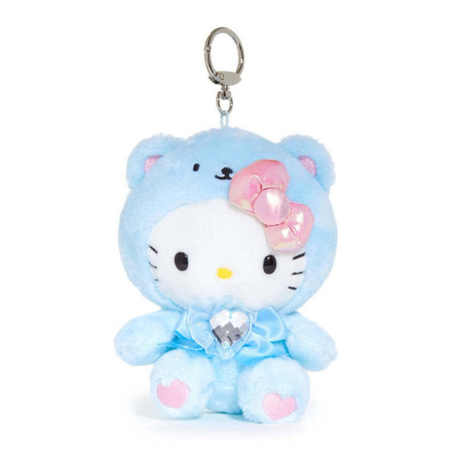 An officially licensed Sanrio Hello Kitty March birthstone plush keychain clip wearing a pastel blue bear hood, an iridescent pink bow, and a blue ribbon with a heart-shaped faux gemstone.