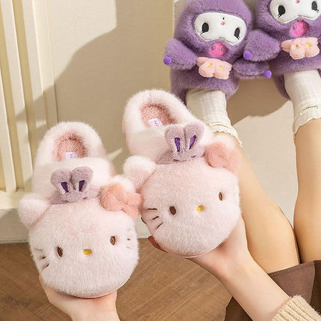 Sanrio officially licensed Hello Kitty Bunny Head Fur Slippers for children. Features include a fluffy pink exterior, iconic Hello Kitty face with bunny ears, and a soft, warm lining perfect for home lounging.