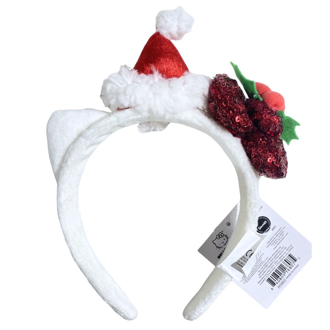 Christmas-themed Hello Kitty headband with Santa hat and holly design on a white background