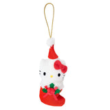 Sanrio Hello Kitty is dressed for the season wearing a red Santa hat with a white pom-pom while sporting his signature red bow. She sits snugly in a red Christmas stocking adorned with green holly leaves and a decorative ribbon. Crafted from soft plush material, this ornament has a cozy, huggable feel. The attached gold cord loop makes it easy to hang on your Christmas tree.