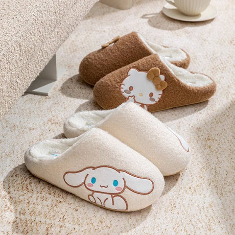 A officially licensed Sanrio collection of sherpa fleece Hello Kitty and Cinnamoroll slippers with a white fleece interior, featuring a side-profile of each character embroidery.