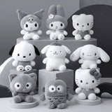 An officially licensed Sanrio Hello Kitty, Dear Daniel, My Melody, Cinnamoroll, Kuromi, Pompompurin, Pochacco, Chococat, and Hangyodon plush dolls each dressed in their iconic outfits in monochrom white and gray color