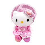 An officially licensed Sanrio Hello Kitty plush doll wearing an ornate pink satin Lolita-style dress with white lace trim, a matching oversized lace bonnet, and shimmering metallic pink shoes.