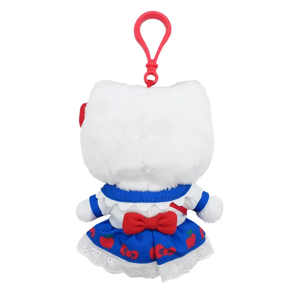 Officially licensed Hello Kitty plush keychain wearing a detailed white and blue dress with a scalloped white collar, red buttons, an apple-printed blue skirt, and a white eyelet lace hem, with a mini Hello Kitty face crossbody bag.