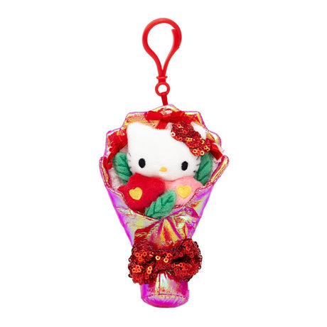 An officially licensed Sanrio Hello Kitty plush bouquet keychain featuring a white plush character head and colorful flowers wrapped in shimmering iridescent fabric. The bouquet is finished with a large, sparkling red sequined bow at the base for a festive touch.