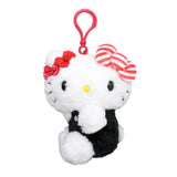 Officially licensed Hello Kitty plush keychain in a black outfit, featuring three stacked bows: one solid red, one red-and-white polka dot, and one large red-and-white striped bow.