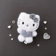 This Officially licensed Sanrio fluffy Hello Kitty plush is the perfect blend of "kawaii" culture and modern, neutral aesthetics. Features Hello Kitty’s iconic silhouette, complete with her signature bow and whiskers in a unique charcoal grey and snowy white colorway.