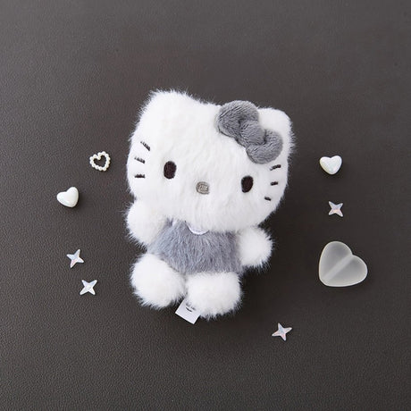 This Officially licensed Sanrio fluffy Hello Kitty plush is the perfect blend of "kawaii" culture and modern, neutral aesthetics. Features Hello Kitty’s iconic silhouette, complete with her signature bow and whiskers in a unique charcoal grey and snowy white colorway.