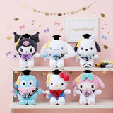 An officially licensed collection of Sanrio 10-inch Hello Kitty My Melody Cinnamoroll Kuromi Pochacco Hangyodon graduation plushies sitting upright, each wearing a black graduation cap with a yellow tassel and a bow around the neck while holding a white diploma