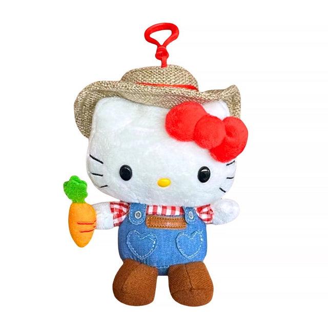An officially licensed Hello Kitty plush clip-on wearing a straw hat and denim overalls, holding a plush carrot, with a red plastic clip.