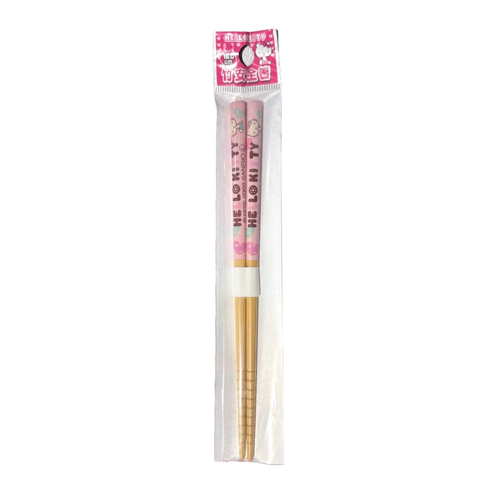 A pair of officially licensed Sanrio Hello Kitty bamboo chopsticks sealed in clear plastic packaging, featuring a pink upper handle decorated with Hello Kitty characters and text, and grooved tips at the bottom.