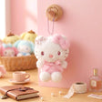 Officially licensed Sanrio Hello Kitty pink tone plush keychain styled in dreamy pastel pink and soft white hues with color-matched embroidered features, dangling from a ball chain