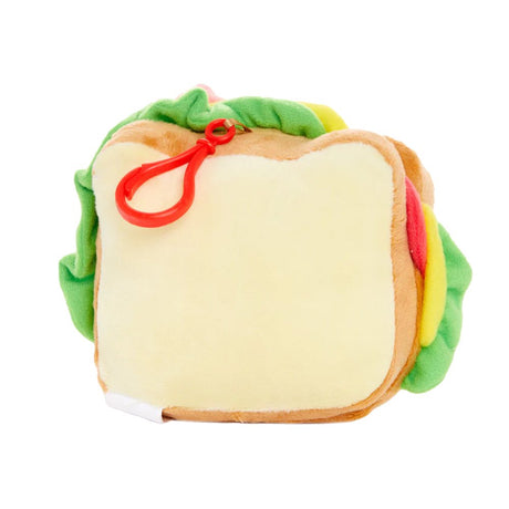 An officially licensed Sanrio Hello Kitty plush designed to look like a sandwich with visible layers of felt lettuce and cheese. The plush has a red plastic clip attached to the top and features her iconic pink bow and whiskers.