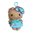 An officially licensed Sanrio Hello Kitty plush keychain clip featuring tan fur, a shimmering blue dress, a metallic seashell headband, and a light-blue clip.