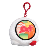 An officially licensed Sanrio Hello Kitty sushi plush keychain shaped like a round sushi roll with white sherpa fabric. The top features a printed sushi filling design, and the side includes Hello Kitty's face and a 3D red bow with a red plastic clip attached.