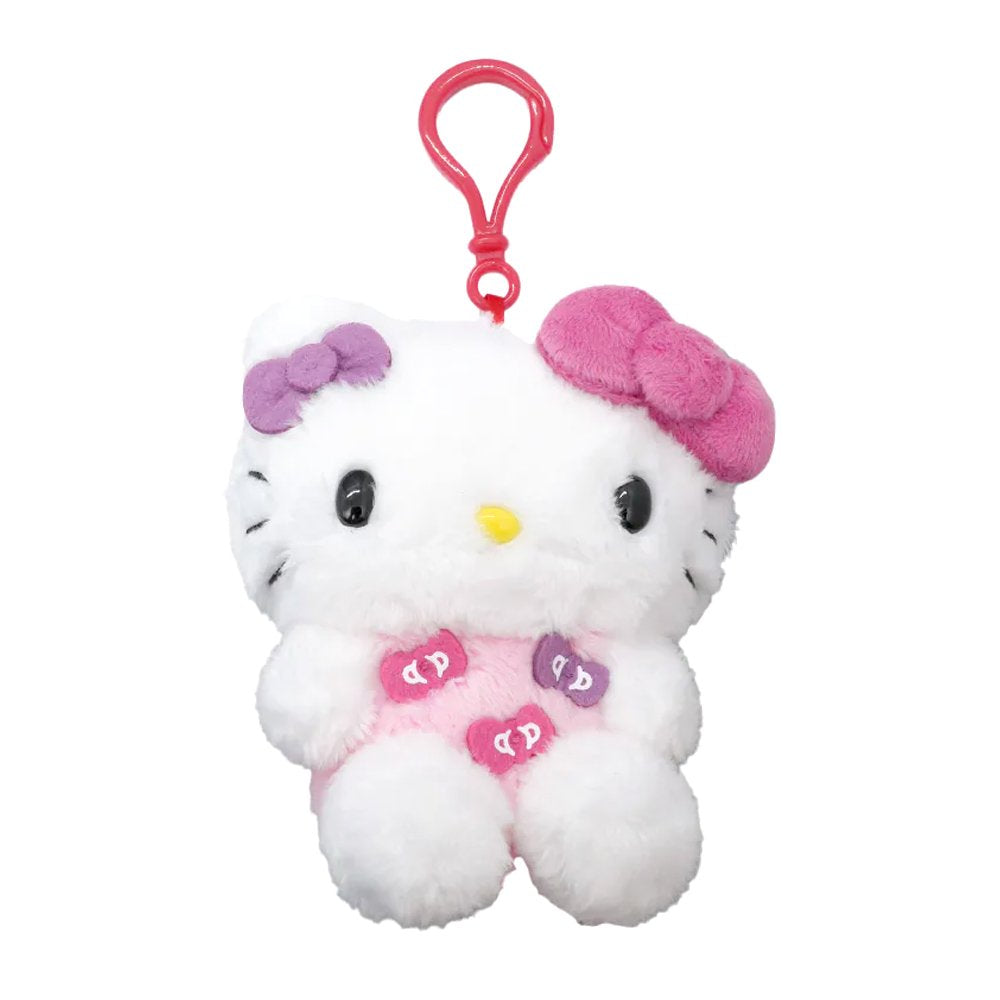 Officially licensed Hello Kitty plush keychain wearing a pink outfit with bow patches, featuring a small purple bow and a large pink plush bow on her head.