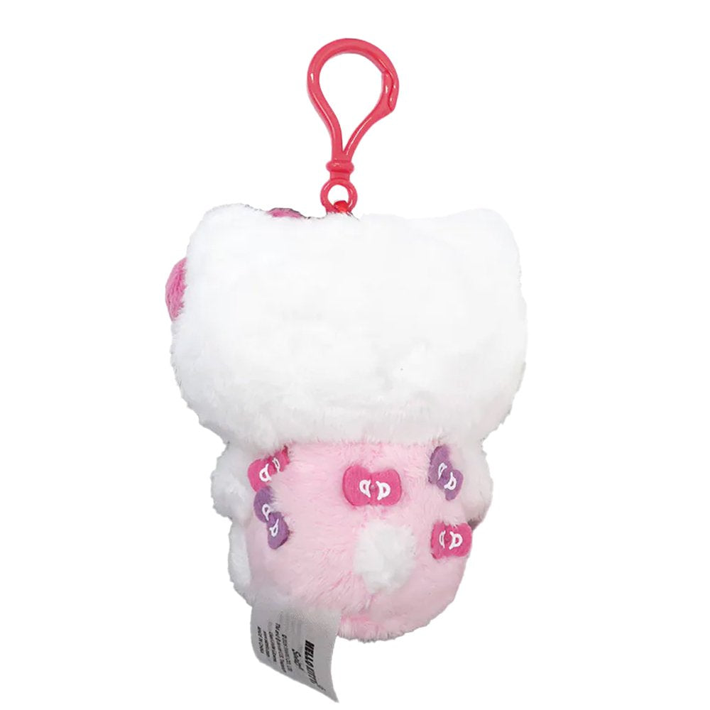 Officially licensed Hello Kitty plush keychain wearing a pink outfit with bow patches, featuring a small purple bow and a large pink plush bow on her head.