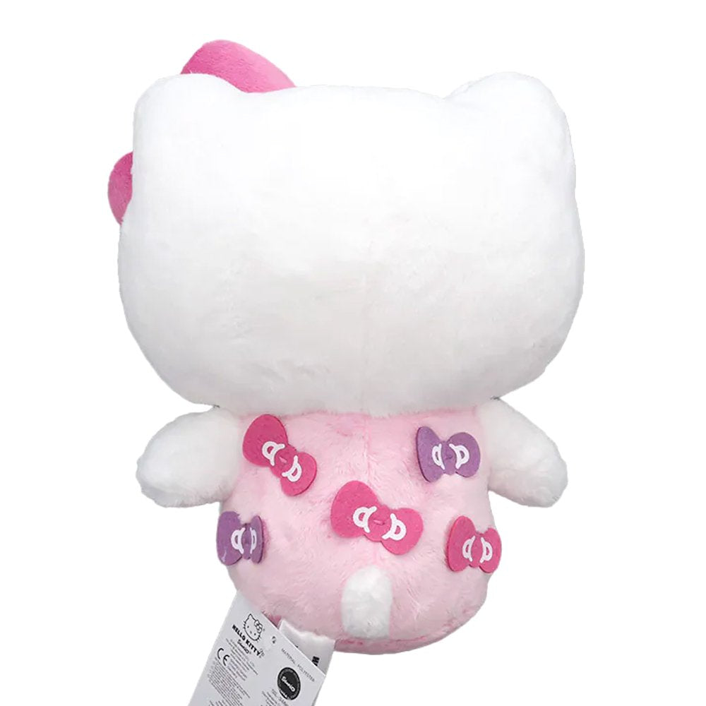 Officially licensed Hello Kitty plush toy wearing a pink outfit with bow patches, featuring a small purple bow and a large pink plush bow on her head.