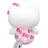 Officially licensed Hello Kitty plush toy wearing a pink outfit with bow patches, featuring a small purple bow and a large pink plush bow on her head.