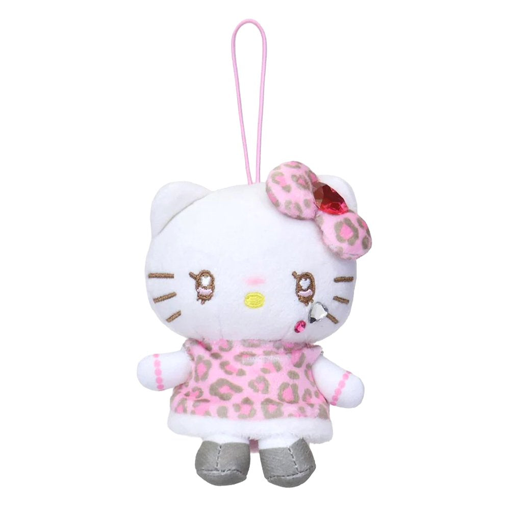 An officially licensed Sanrio Hello Kitty plush keychain featuring a white kitty with heart-shaped eyes, a pink leopard print dress, and a matching bow with a red jewel. The mascot includes metallic silver shoes and a pink elastic hanging loop.