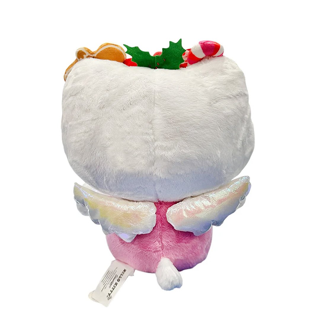 This exclusive Hello Kitty x Tokidoki collaboration is perfect for the holiday season. Her oversized head opens to reveal a collection of mini plush toys including a snowman with red and green buttons, a white polar bear in a red Santa hat, a festive gingerbread man with icing details, green holly leaves with red berries and candy cane. Hello Kitty herself features the signature Tokidoki heart and crossbones skull bow accent in her iconic red bow, along with soft pink cheeks and iridescent holographic wings