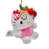 This exclusive Hello Kitty x Tokidoki collaboration is perfect for the holiday season. Her head opens to reveal a collection of mini plush toys including a snowman with red and green buttons, green holly leaves with red berries and candy cane. Hello Kitty herself features the signature Tokidoki heart and crossbones skull bow accent in her iconic red bow, along with soft pink cheeks and iridescent holographic wings on back.