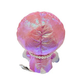  Hello Kitty x Tokidoki design is perfect for the holiday season. Hello Kitty sports a trendy look with an iridescent pink holographic beanie adorned with her signature purple bow decorated with a white heart and crossbones skull Tokidoki mark. She's dressed in a stylish pink holographic vinyl puffer jacket and holds an adorable purple bear plush with a pearl chain strap, giving her a fashionable streetwear vibe. Her soft plush body in white and purple creates the perfect bean doll silhouette for displaying