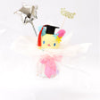 An officially licensed Class of 2026 Sanrio graduation gift set featuring six popular plush characters, Usahana, Corocorokuririn, Wish Me Mell, and Dinguri Days Mashu wearing black graduation caps. The characters are arranged like a bouquet with silver star balloons and "Congrats Grad" decorations.