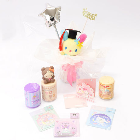 An officially licensed Class of 2026 Sanrio graduation gift set featuring six popular plush characters, Usahana, Corocorokuririn, Wish Me Mell, and Dinguri Days Mashu wearing black graduation caps. The characters are arranged like a bouquet with silver star balloons and "Congrats Grad" decorations.
