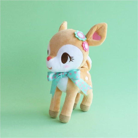 Sanrio Hummingmin plush deer toy with a bow and flower decorations on a light green background