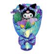 An officially licensed Sanrio Kuromi plush bouquet featuring the character nestled among purple flowers, wrapped in shimmering iridescent blue fabric. The bouquet is accented with purple satin ribbons and a large, sparkling purple sequin bow at the base.