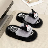 A pair of officially licensed Sanrio Kuromi plush slippers featuring black and white faux fur, a leopard print footbed, and a 3D Kuromi face plush on top.