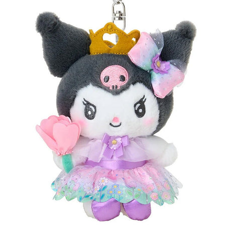 A plush keychain of the Sanrio character Kuromi dressed as a princess. She has grey fur, a pink skull on her forehead, and wears a golden crown. Her outfit includes a purple satin dress with a floral organza overlay and a rainbow-gradient bow with a purple flower. She is holding a pink flower and is attached to a silver lobster clasp.