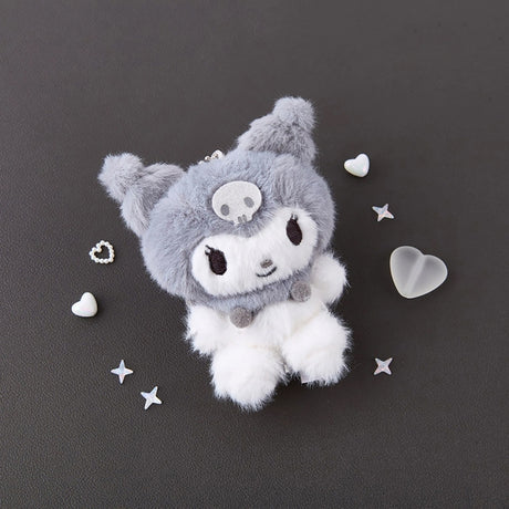 An officially licensed Sanrio character, Kuromi is showcased in her signature jester hat—rendered in a plush grey—complete with her iconic skull emblem and fuzzy pom-pom accents. Her neutral tones and "dark kawaii" aesthetic make her the perfect addition to a modern bedroom, a curated shelf, or a monochromatic desk setup.