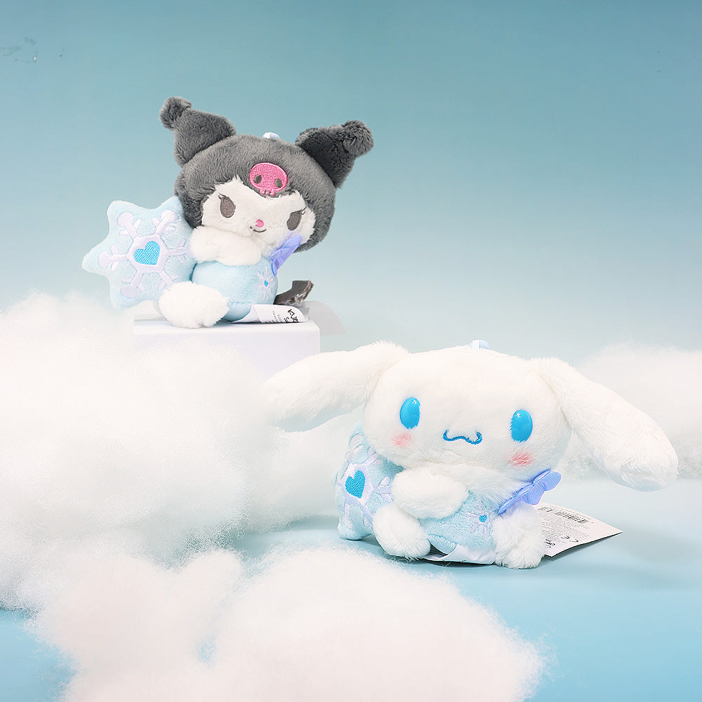 Kuromi and Cinnamoroll Snow Angel plush mascots sitting on white clouds against a blue sky, featuring iridescent bows and blue wings.Perfect for gifting, collecting, or decorate bedroom!