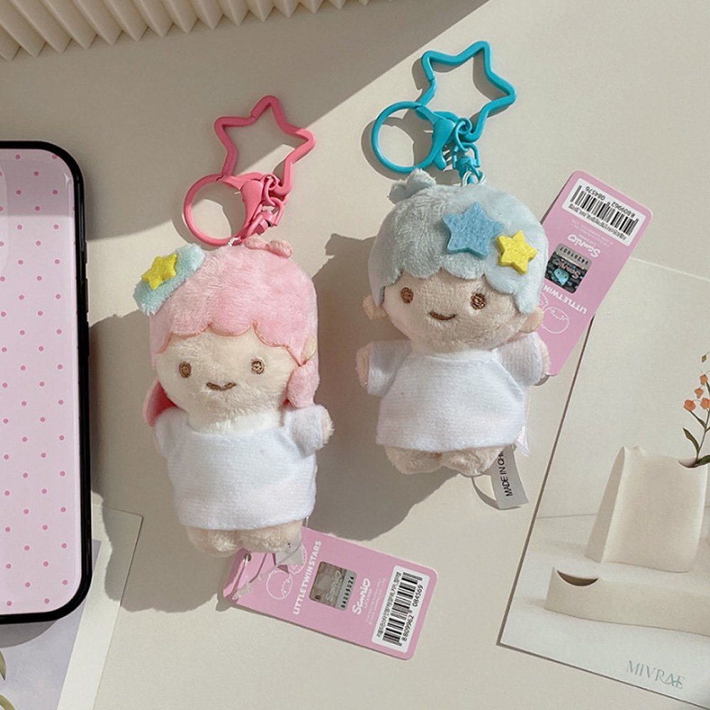 Two Little Twin Stars plush keychains with star designs on a light surface