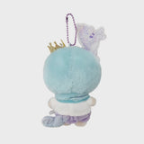An officially licensed Sanrio Kiki Little Twin Stars plush keychain wearing a blue unicorn hood with a gold crown and horn. The plush has purple shorts, a star-shaped bow, and is attached to a purple ball chain with a unicorn acrylic charm.