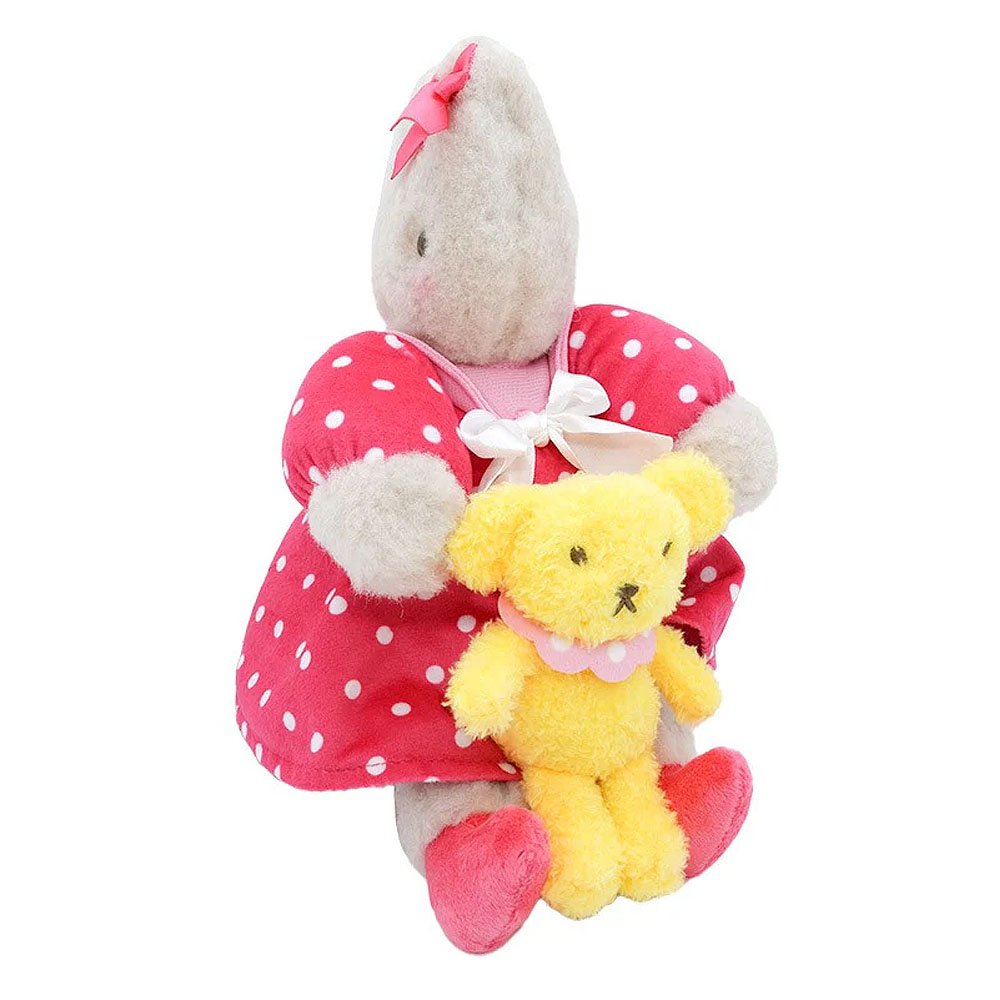 Sanrio Marron Cream a pink dress holding a yellow teddy bear on a white background