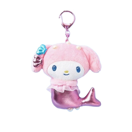 An officially licensed Sanrio character, My Melody mermaid plush keychain featuring a metallic pink tail, pink hood, and small shell accessories on her ear. She has a sheer pink ruffle around her waist and a pink plastic clip.