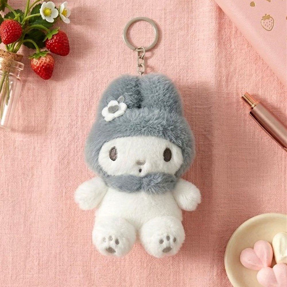 An officially licensed Sanrio My Melody fluffy white plush keychain wearing a gray hooded ears and a bow