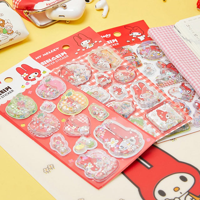 Pack of officially licensed My Melody water shaker stickers featuring glitter-filled, liquid-effect designs.