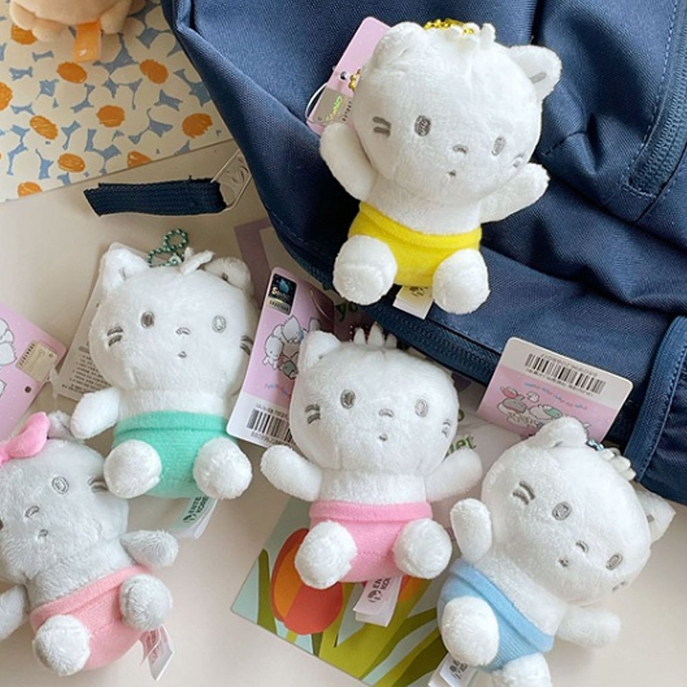 Sanrio Official License Nya Ni Nyu Nye Nyon plush keychains set featuring five white and gray baby cats wearing small pastel-colored diapers or pants.