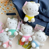 Sanrio Official License Nya Ni Nyu Nye Nyon plush keychains set featuring five white and gray baby cats wearing small pastel-colored diapers or pants.