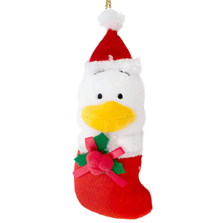 Sanrio Pekkle is dressed for the season wearing a red Santa hat with a white pom-pom while sporting his signature red bow. He sits snugly in a red Christmas stocking adorned with green holly leaves and a decorative ribbon. Crafted from soft plush material, this ornament has a cozy, huggable feel. The attached gold cord loop makes it easy to hang on your Christmas tree.