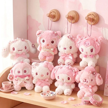Officially licensed Sanrio collection of pink tone plush keychains adorned with cherry blossom flower crowns, pearl details, and satin bows