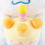 Officially licensed Sanrio Pochacco plush, wearing a charming white party hat topped with a bright yellow tassel, and holding a cake for celebrating a special day
