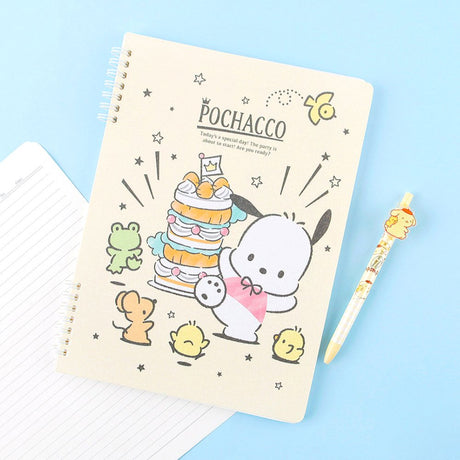 A soft yellow, officially licensed Pochacco spiral lined notebook featuring Pochacco celebrating next to a cake and the little friends.