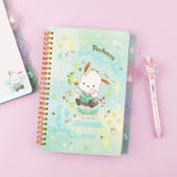 An officially licensed Sanrio Pochacco spiral-bound notebook, featuring a glitter finish with gold stars and an illustration of Pochacco. Includes four distinct, colorful dividers and five different interior page designs.